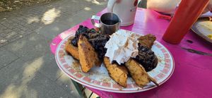 French toast with maple syrup, blueberries, and vegan whipped cream at Mamalicious in Hamburg