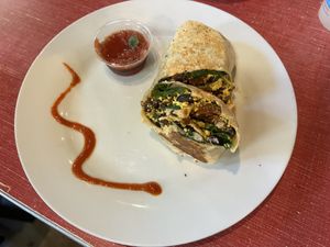 Vegan Breakfast Burrito- tofu scramble, house vegan sausage, spinach, black beans, vegan spicy mayo  at The Sentient Bean in Savannah
