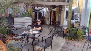 Seating is available on the 
 back patio (photo) and on the front sidewalk at The Sentient Bean in Savannah