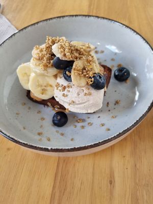 Banana bread with peanut butter, banana, and blueberries (the whipped cream was unexpected and was so light and cloudy) at Lōf Bakery in Barcelona