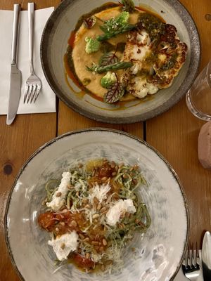 Cauliflower steak and spaghetti with creamy sauce and pistachioos  at Kin Restaurant in London