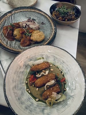 Broad bean croquettes, sticky tofu, and tomato gnocchi  at Kin Restaurant in London
