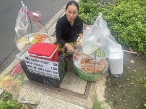Friendly owner   at Roadside street food stall in Ho Chi Minh City