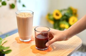 Cold pressed juice and the most popular smoothie, the Choco Brain: organic cacao, dates, banana, reishi and maca adaptogens, almond butter, cinnamon, almond milk. 100% vegan. at Curiosa | Cafe & Juice Bar in Mexico City