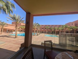 Sitting by the pool at La Pergola - Hôtel Oasis Palm in Guelmim