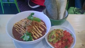 Vegetable chilli with cashew cheese, salsa, guacamole and blue flour wraps at Wildebeest in Falmouth