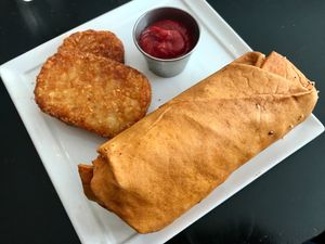 Breakfast burrito. Good, but the pre-made fast food style hashbrown was disappointing.  at Higher Taste Plant Based in Long Beach