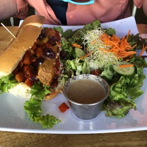 Pizza Dog with side salad at Higher Taste Plant Based in Long Beach