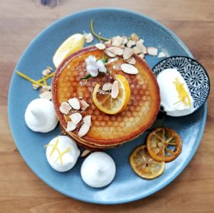 Fluffy American pancakes with Lemon cheesecake filling, vegan honey and meringue at Kaiaroha Vegan Deli and Eatery in Auckland
