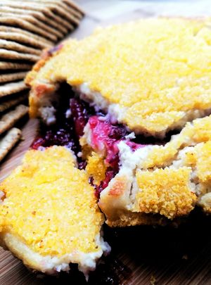 Hot cranberry, aged cashew cheese with grilled polenta crust. Christmas treat! at Kaiaroha Vegan Deli and Eatery in Auckland