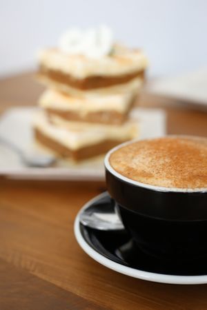 Delicious organic coffee from award winning Incafe. Background...coffee caramelle custard squares. at Kaiaroha Vegan Deli and Eatery in Auckland
