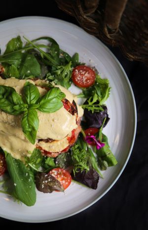 Aubergine Parmagiana. Layers of breadcrumbed golden fried Aubergine, marinara and cashew cheese. at Kaiaroha Vegan Deli and Eatery in Auckland