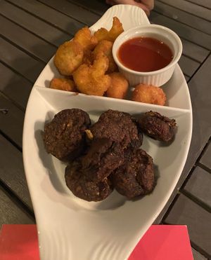 Tapas - cauliflower wings and chilli sauce + stuffed mushroom  at Lu-Ma Cafe in South West London