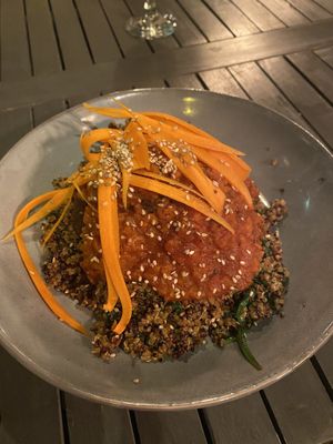 Vegan lentil balls - Lentil & walnut balls in herby tomato sauce with sauteed quinoa & spinach topped with carrot julienne & sesame seeds at Lu-Ma Cafe in South West London