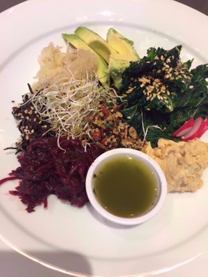 Quinoa buddha bowl with avocado, steamed kale, hummus, red cabbage, radish. at Lu-Ma Cafe in South West London