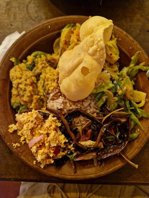 Rice and four vegetable curries with papadam at House of Kitchen in Ella