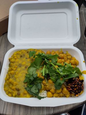 Vegan chickpea curry with rice dhal and homemade chilli oil at Tibet Flavour in Ely
