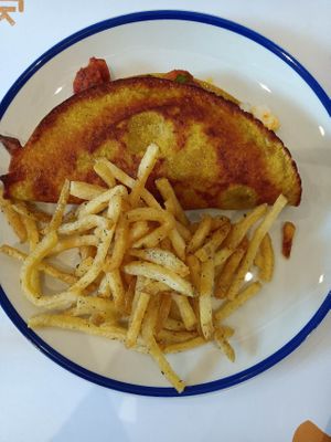 Tomato, feta, sausage omelette with fries. at GNOU in Athens