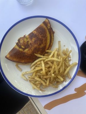 Vegan omelet with tomato and sausage filling with oregano chips  at GNOU in Athens