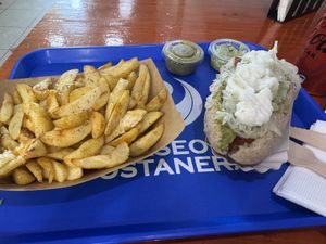 Completo tradicional + Papas Rústicas  at Dharma in Puerto Montt