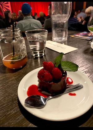 Vegan chocolate cake with raspberry coulis at Spotlight Cabaret  in Edmonton
