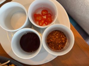 Chilli flakes, chilli with sauce at Seasonal Tastes in Bangkok