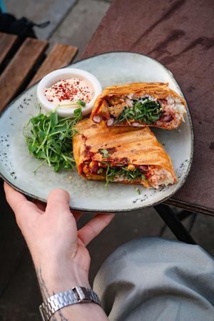 vegan burrito with tempeh, red bean salsa, rice and chilli mayo at Café Morgal in Brno