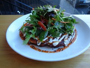 chickpea & kimchi savory pancake with greens and cashew aioli at Little Bird Kitchen in Auckland