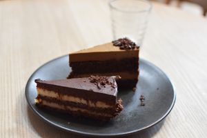 Tiramisu cake slice (behind) + chocolate layer cake (in front) at Little Bird Kitchen in Auckland