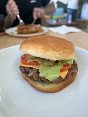 Delicious made from scratch black bean burger. Pumpkin pancakes in the background. at VGarden Caffé in Luquillo