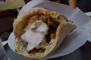 Seitan shawarma in pita bread, with tahini on top at Doobie's Vegan Bar in Haifa