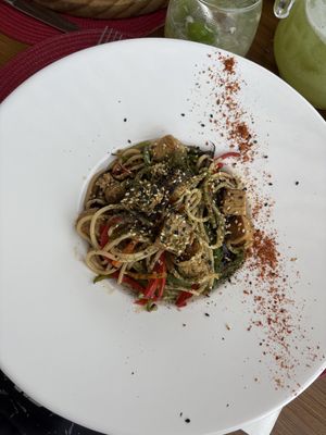 El Yaki (pasta con vegetales y tempeh). Abundante; el plato es hondo.  at Pura Vida Resto in La Barra