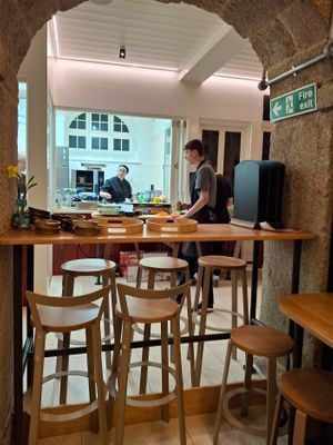 Cath is in the background, cheerily working to provide the delicious meal.  One of her helpers doing his part. at Cath's Cornish Kitchen - Maybe closed in Redruth