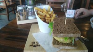 Veggie burger with vegan brown bread and fries. at May and Mark Restaurant in Krabi