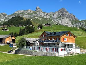 Alphotel Biel-Kinzig in sumer time with the mountains Rossstock and Fulen at Alphotel Biel-Kinzig in Buerglen