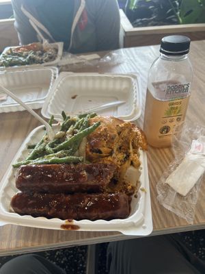 Two entrees with one side and some lemongrass tea  at Dodah's Kitchen in Newark