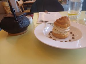 Pistachio and berry cream puff and a pot of earl grey tea with oat milk, LAS, 29/4/25 at LAS in Lodz