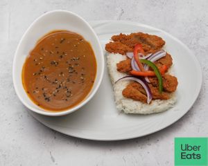 Panko crumbles crispy vegetables marinated with our homemade rub, served with a delicious homemade curry, sauce with carrots and baby potatoes, steamed rice & garnished with pepper at The Fusion Thai in Bexley