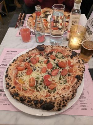 Vegan pizza with grilled vegetables - added extra tomatoes as topping at Pizza Beppe in Alkmaar