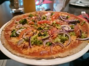 brokkoli, onion and tomato Pizza with spelt dough at Pizzeria Casa Piccola in Vienna