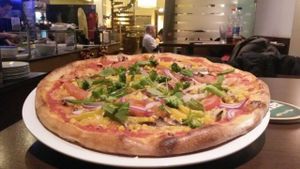 Delicious vegan pizza with vegan cheese and all kinds of vegetables at Pizzeria Casa Piccola in Vienna