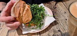 Chicken avocado bun buried under a big pile of rocket at Stach in Haarlem