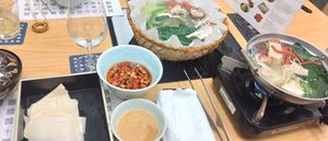 Shabu shabu with 2 sauces, the "meat" (left) and veggies (right) at Kyōto Hyōto Kyōto Ekimae Honten in Kyoto