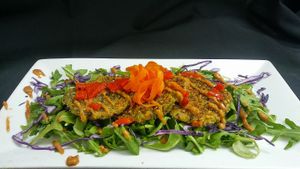 #Vegan #CrabCakes atop a bed of #Organic #Arugula topped with a #Housemade #Vegan #Ramalade! at Cafe Evergreen in Nokomis