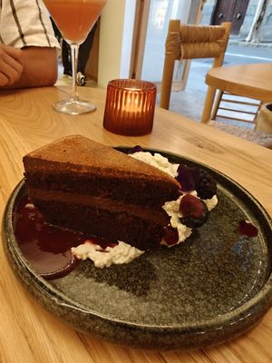 Chocolate cake with berry coulis and cream at DÔME in Mallorca