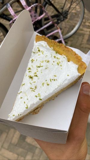 Pineapple cocos cake. New cake, and oh so tasty! A buttery dough topped with pineapple Creme and fluffy whipped cream 🤤   at KLUTS in Utrecht