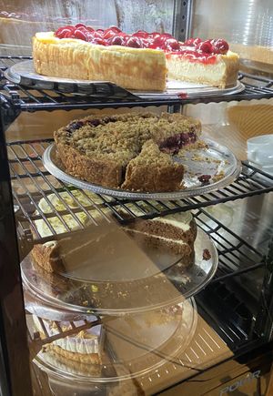 Sunday 31 August 2025: cherry cheesecake, forest fruit crumble, carrot cake and white chocolate/lavender pie. All very good!  at KLUTS in Utrecht