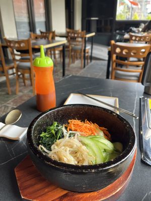 Dolsot bibimbap and outdoor seating   at Cahchi Korean BBQ Restaurant in New Malden
