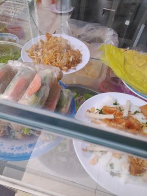 Prepared vegan foods including banh xeo at Cơm chay Phước Duyên 18 Ngàn in Ho Chi Minh City