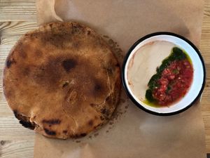 Filled pastry with dipping sauce at Nanuchka in Tel Aviv